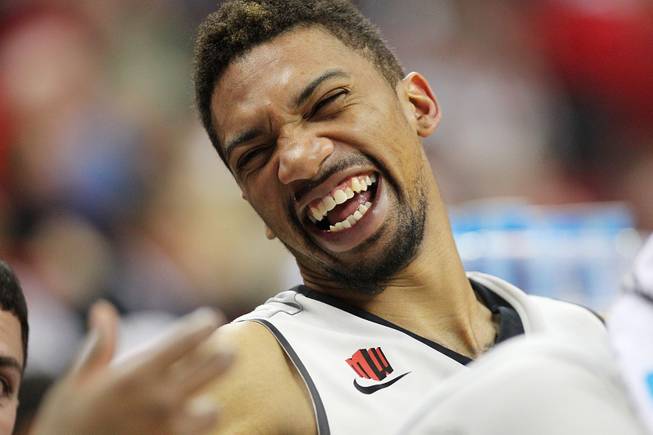 UNLV forward Khem Birch laughs while sitting on the bench during their game against Sacred Heart  Friday, Dec. 20, 2013 at the Thomas & Mack Center. UNLV won the game 82-50.
